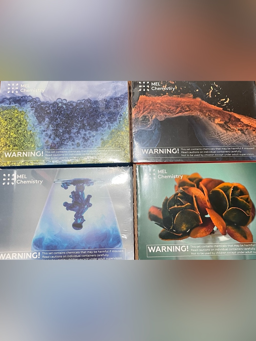 Four Mel Science chemistry sets